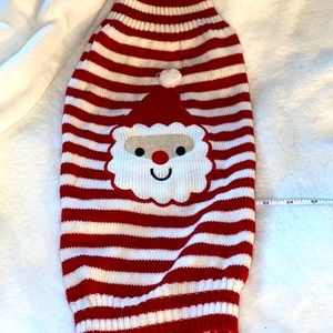 Dog striped Santa Claus sweater size large from 2012. Hundred percent acrylic..